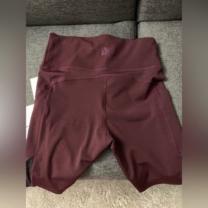 NWT Plum biker shorts with lace design.